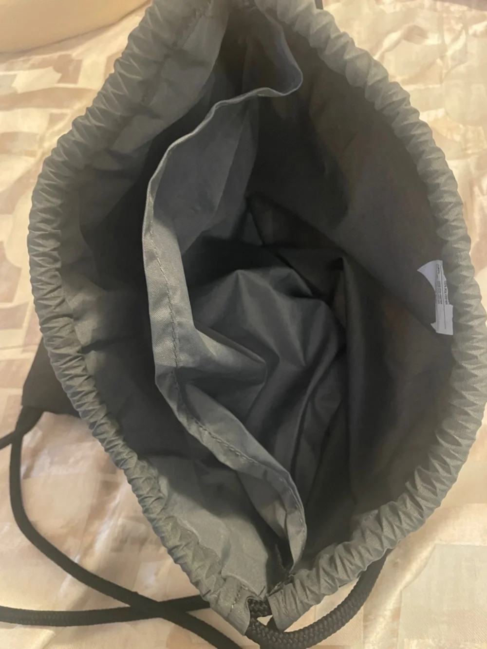 Nike Gray and Black Drawstring Backpack with White Swoosh